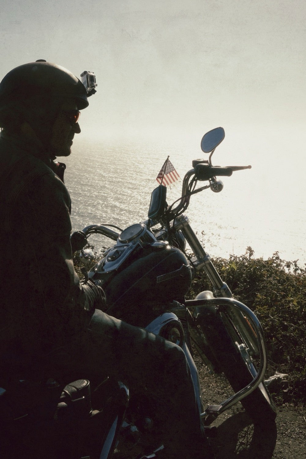Motorcyclist looking out on route one and feeling peace