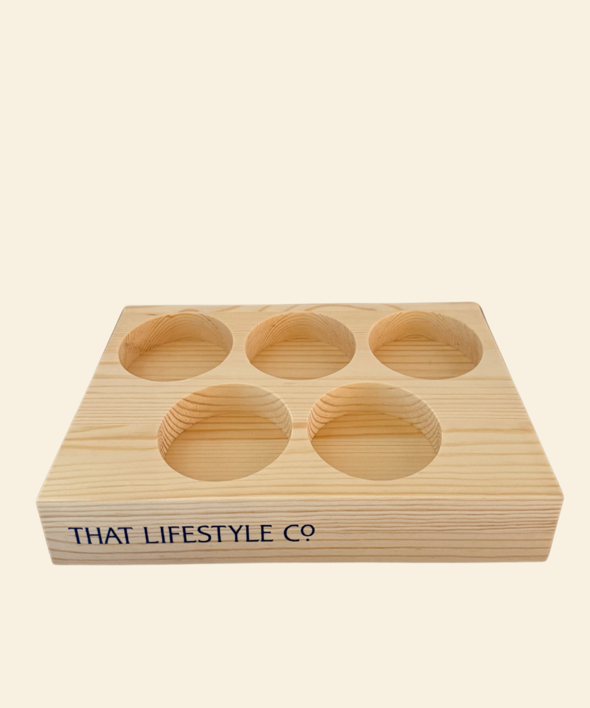 A handcrafted wooden tea tray made from pine, featuring five circular compartments designed to neatly hold tea tins, with a smooth natural finish